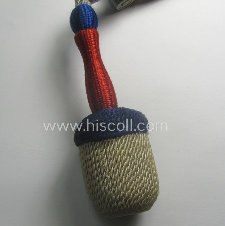 Bright-blue-, red- and/or silver-coloured, EM- (ie. NCO-) type side-arm knot (ie. 'Portepee' ie.: 'Troddel') as was used for the various WH-bayonets and that comes in an overall very nice- (ie. 'virtually mint- ie. unissued'-), condition