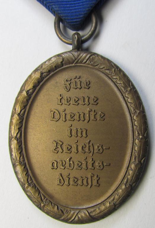 Attractive example of a: RAD (ie. 'Reichsarbeitsdienst') so-called: 'Dienstauszeichnung 4. Stufe für Männer' as was intended for 4 years loyal-service and that comes mounted onto its period piece of ribbon (ie. 'Bandabschnitt')