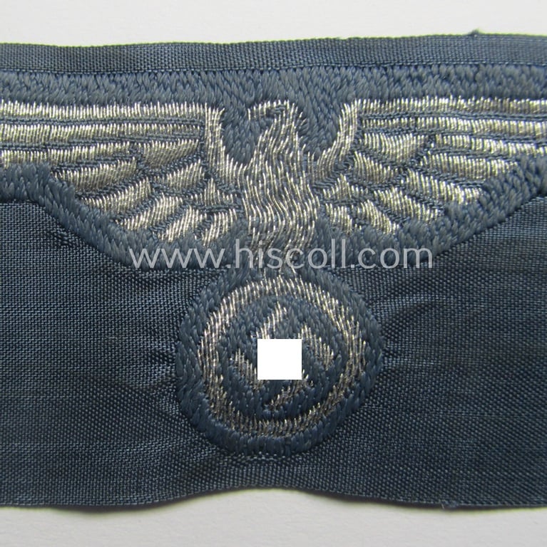 BZP (ie. 'Bahnschutz-Polizei') officers'- (ie. NCO-) pattern side-cap- (ie. 'Schiffchen'-) eagle as woven in 'flat-wire-BeVo'-style and executed in bright-silver thread on a greyish-blue-coloured and/or linnen-based background