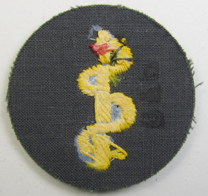 WH (Heeres) so-called trade- and/or special-career-insignia (ie.: 'Heeres-Tätigkeitsabzeichen') as was intended for: 'Sanitätspersonal' (or: medical orderlies- ie. staff)