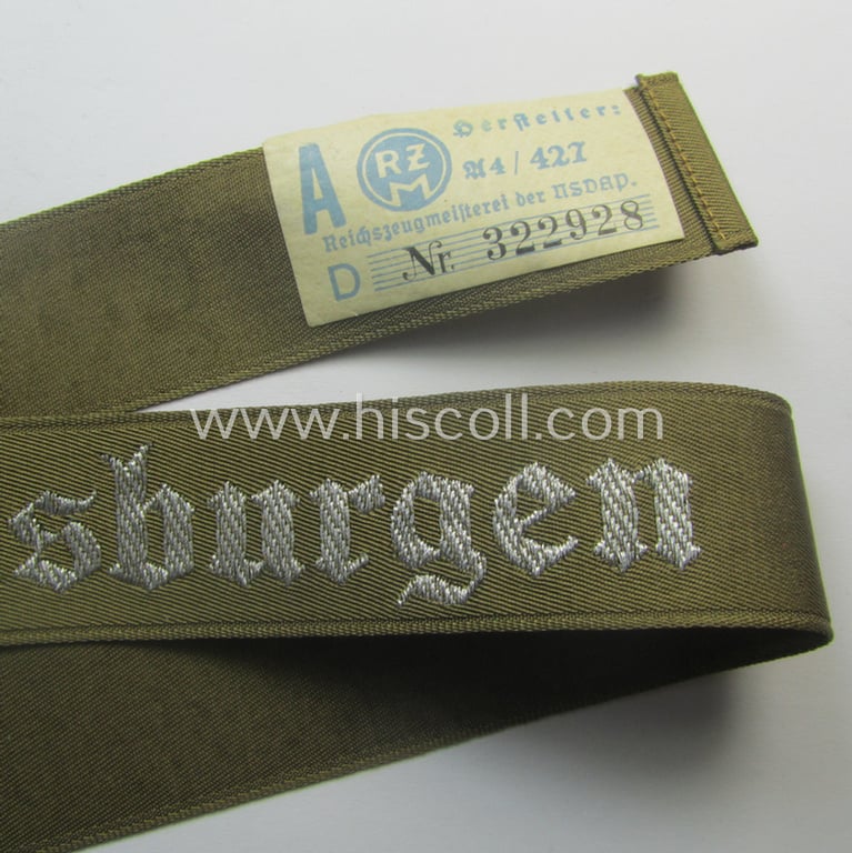 Superb - full length and 'flat-wire'-woven! - 'N.S.D.A.P.'- (ie. 'Politische Leiter'-) related cuff-title (ie. 'Ärmelstreifen') entitled: 'Ordensburgen' (being a 'virtually mint- ie. unissued' example that still retains its 'RzM'-etiket)