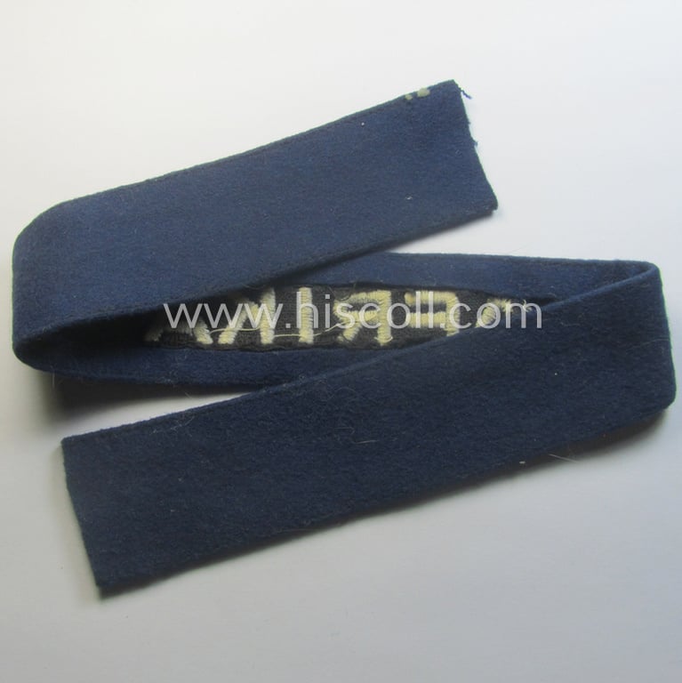 Darker-blue toned, WH (Luftwaffe) cuff-title (ie. 'Ärmelstreifen') entitled: 'Afrika' (being a full-length example that comes in an issued-, used and/or carefully tunic-removed, condition)
