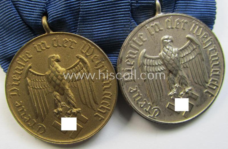 Attractive, two-pieced medal-bar (ie. 'Spange') showing two: WH (Heeres o. Kriegsmarine) so-called: 'Dienstauszeichnungen für 4 u. 12 Jahre Treue Dienste' that both come period-mounted as a so-called: 'Doppelspange'