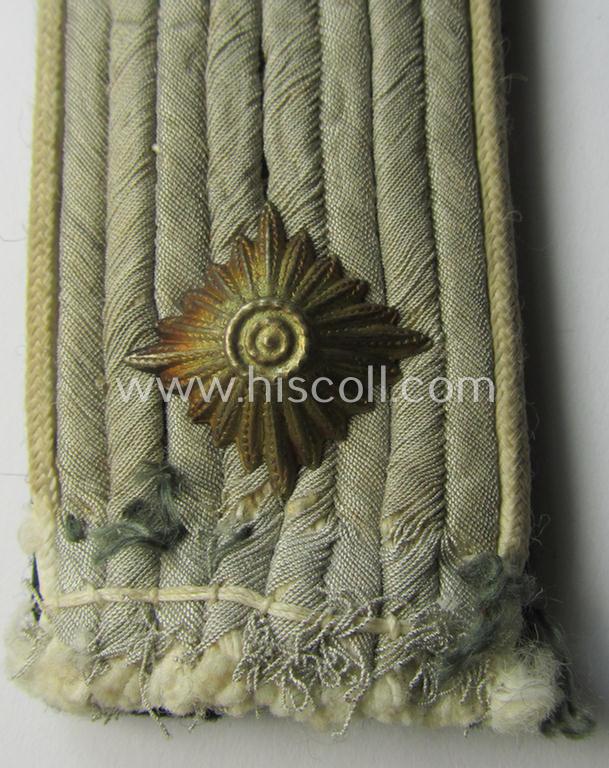 Superb - albeit regrettably single! - Waffen-SS, officers'-pattern shoulderboard as piped in the white-coloured branchcolour as was intended for usage by an: 'SS-Obersturmfuhrer' who served within the: 'Waffen-SS Infanterie-Truppen'