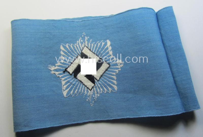 Light-blue-coloured and neatly 'BeVo'-woven, so-called: RLB (or: 'Reichsluftschutzbund') 'Amtsträger'-armband depicting the typical 'RLB'-logo (without lettering) and showing an interwoven makers'-designation (ie. '34'-numeral)