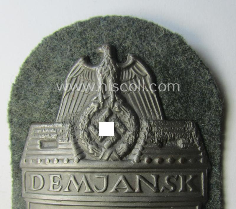 Superb, WH (Heeres ie. Waffen-SS) 'Demjansk'-campaign-shield as executed in typical magnetic, so-called: 'Eisenblech' (and being of the 'missing-log' variant-pattern)