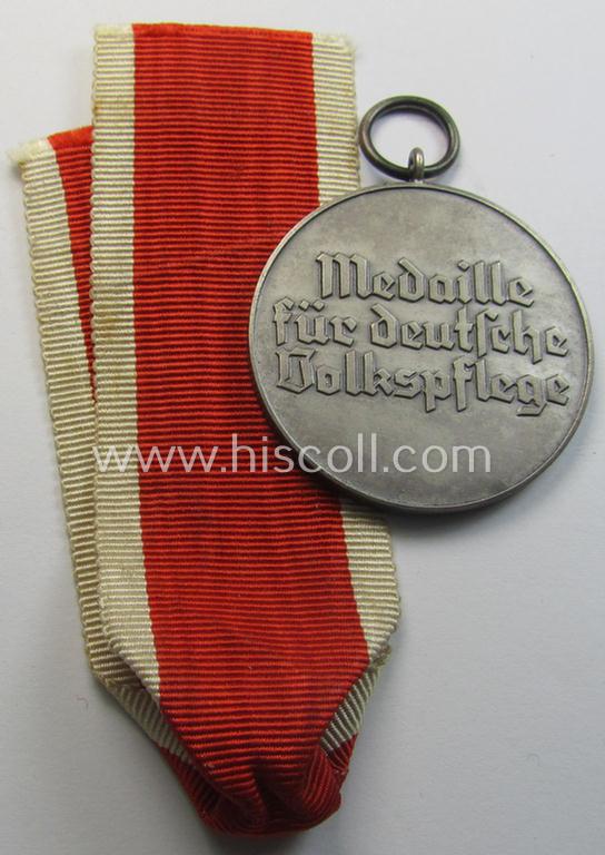 Superb, frosted silver-toned (and I deem zinc- ie. 'Feinzink'-based!) 'Deutsche Volkspflege'-medal being a non-maker-marked example that came together with its (confectioned- and somewhat shortened) ribbon (ie. 'Bandabschnitt')