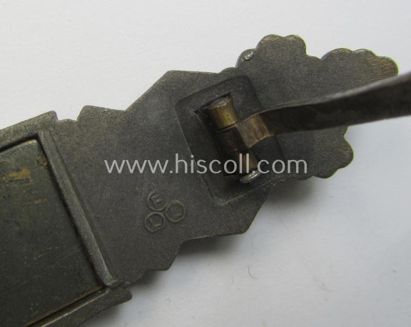 'Nahkampfspange in Bronze' (or: bronze-class close-combat clasp ie. CCC) being a maker- (ie. 'FLL'-) marked- and truly converse-shaped so-called: '3rd pattern'-specimen as was produced by the maker- (ie. 'Hersteller') 'Friedrich Linden'