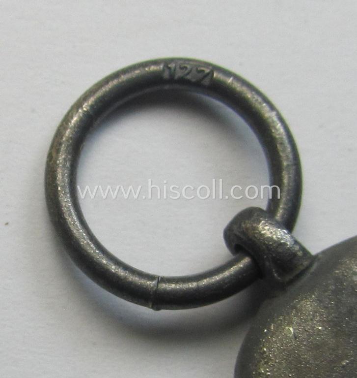 Attractive medal-set: 'Winterschlacht im Osten 1941-42' being a maker- (ie. '127'-) marked- (and/or 'Feinzink'-based) specimen by the maker: 'Moritz Hausch A.G.' and that comes together with its (non-confectioned) ribbon (ie. 'Bandabschnitt...