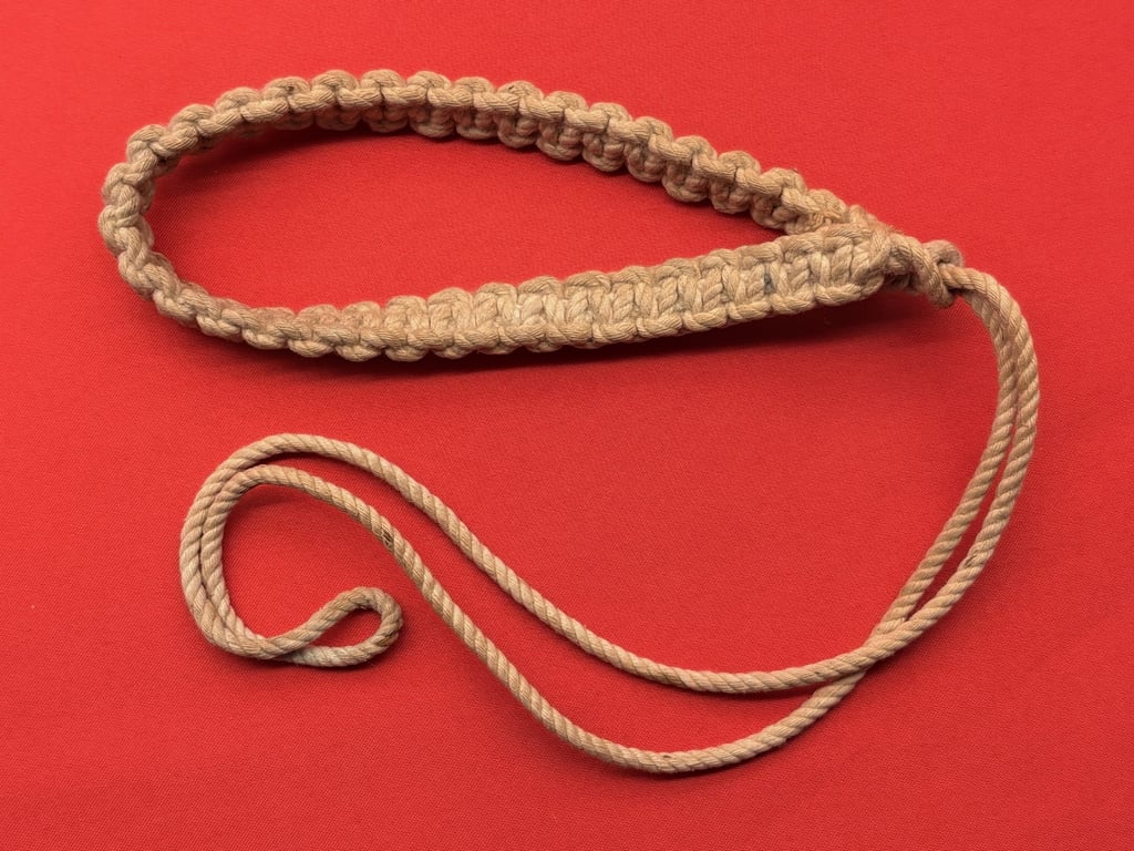 TWO AUTHENTIC ORIGINAL BRITISH OFFICERS WWI 1916 TRENCH WHISTLES AND LANYARD.
