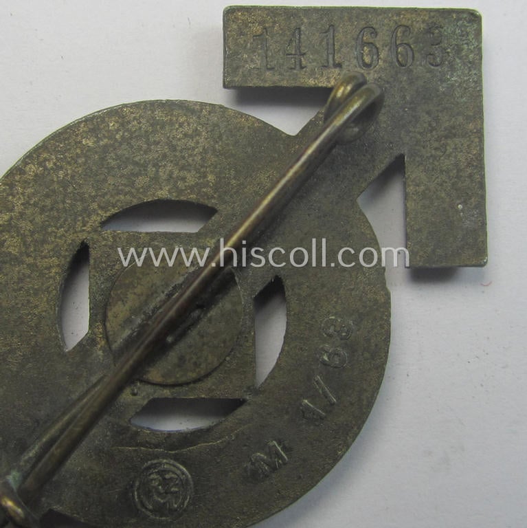 HJ- (ie. 'Hitlerjugend'-) sports-badge (or: 'HJ-Leistungsrune') of the bronze-class being a clearly maker- (ie. 'RzM - M1/63'-) marked- and/or: 'Feinzink'-based specimen that shows an engraved (unique!) bearers'-numeral ('141663')
