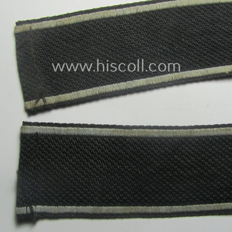 Waffen-SS, 1943-pattern cuff-title (ie. 'Ärmelstreifen') depicting the machine-woven Latin script text in silver-grey linnen as was intended for a member of the: 'SS-Geb.Jäg.-Rgts. 6. (u.11.)': "Reinhard Heydrich"
