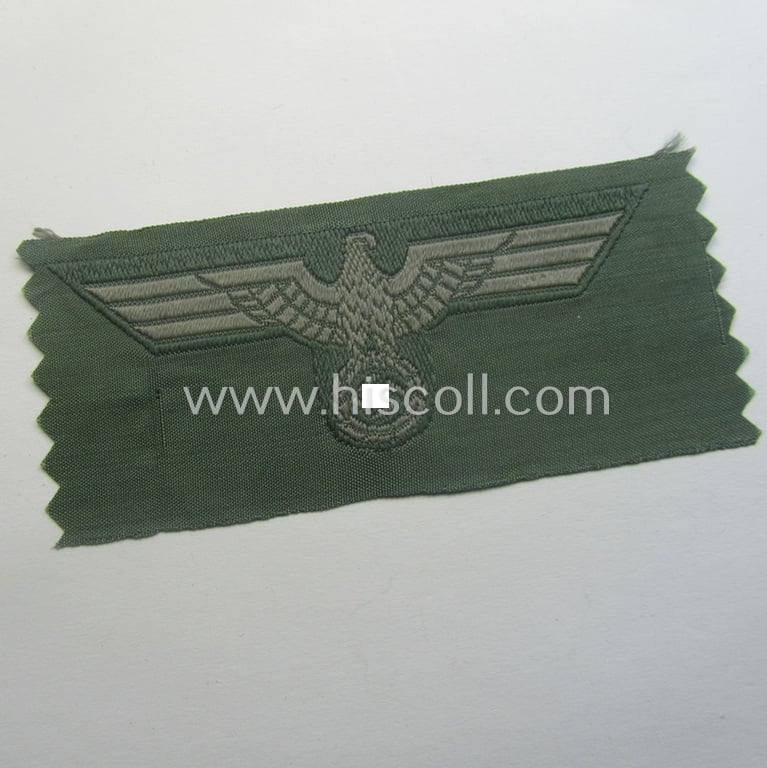 Early- (ie. mid-) war-period, WH (Heeres) cap-eagle & cocarde-set (ie. 'Schiffchenmützen-Adler u. Kokarde-Satz für Mannschaften u. Uffz.') being a 'virtually mint' set as executed in bluish-grey-coloured linnen on a field-grey-coloured background