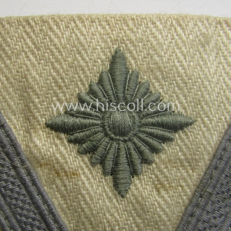 WH (Heeres o. LW) 'Armwinkel' (or: arm-chevron) as executed on beige-white-coloured linnen (ie. HBT-type-cloth) as intended for usage by a soldier with the (unusually encountered!) rank of an: 'Gefreiter mit mehr als 6 Dienstjahren'