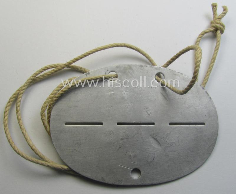 Aluminium-based, WH (LW) ie. 'Fallschirmjäger'-related ID-disc bearing the clearly stamped- and/or: 'coded'-unit- ie. 'MOB'-designation that reads: '62843' (and as such belonging to the: '2./Fsch.Jg.Rgt. 1')