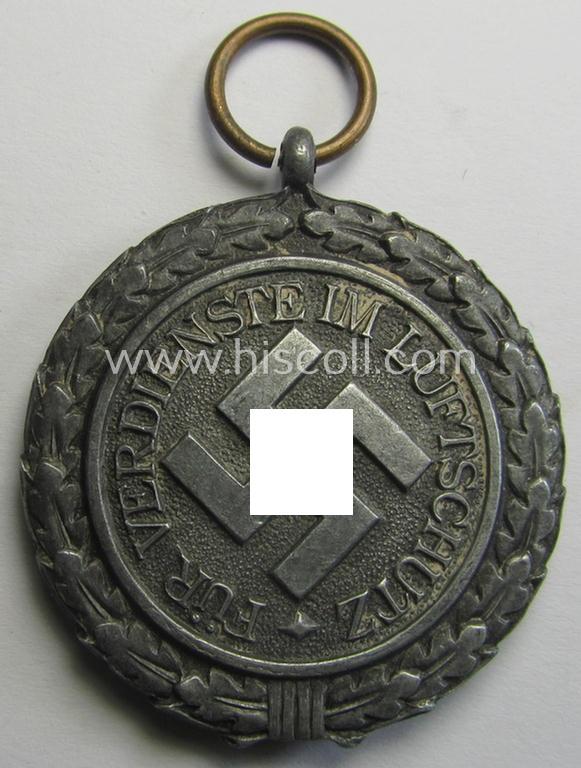 'Luftschutz-Ehrenzeichen 2. Stufe' being a non-maker-marked example, as executed in zinc-based metal (ie. 'Feinzink') and that comes stored in its (scarcely seen!) 'Zellstoff'-based pouch by the maker: 'Katz u. Deyhle'