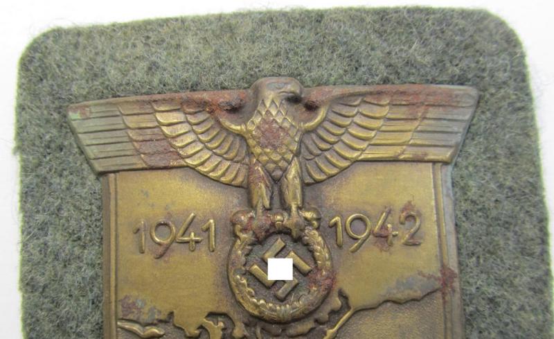 Attractive - albeit minimally rust-stained - WH (Heeres ie. Waffen-SS) 'Krim'-campaign-shield (as was produced by a by me unidentified maker) and that comes in a presumably issued - albeit 'virtually mint', condition