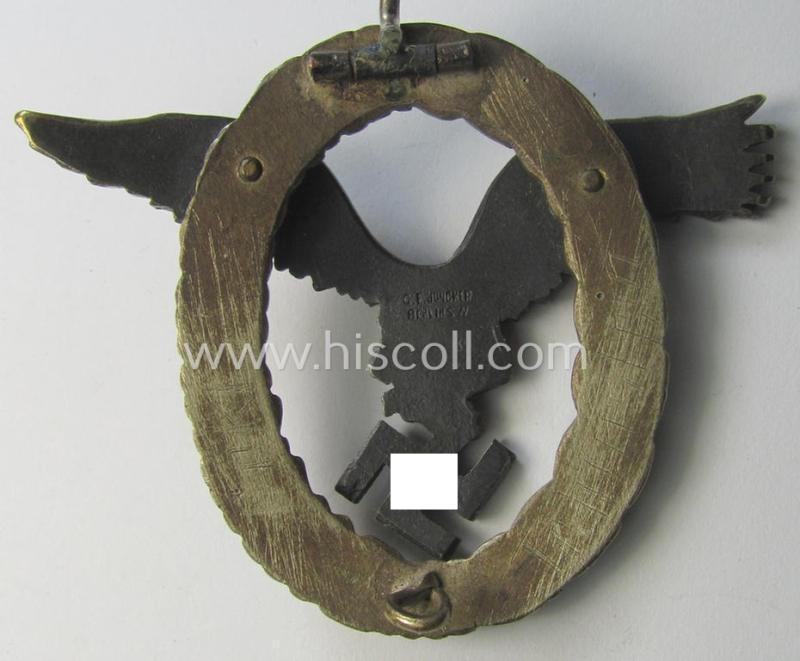 Early- (ie. pre-) war-period- and/or: 'Buntmetall'- (ie. 'Tombak'-) based: WH (Luftwaffe) 'Flugzeugführerabzeichen' (or: pilots-badge) being a clearly maker- (ie. 'C.E. Juncker'-) marked example of the 'J2'-pattern