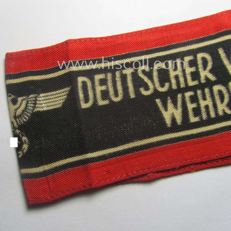 Typically printed- and/or later-war-period, bright-red- and/or black-coloured so-called: 'Deutscher Volkssturm'-armband (ie. 'Armbinde') that comes in an overall nice- (I deem just moderately used- and/or worn-), condition