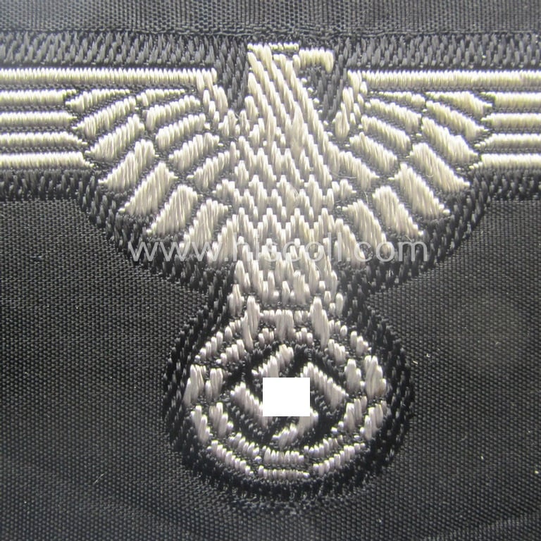 Mid- (ie. later-war-) pattern, 'SS' (ie. 'Waffen-SS') so-called: 'BeVo-weave-style', enlisted-mens'- ie. NCO-pattern arm-eagle (ie. 'Ärmeladler für Mannschaften u. Unterführer') as was intended for usage by the various Waffen-SS-troops