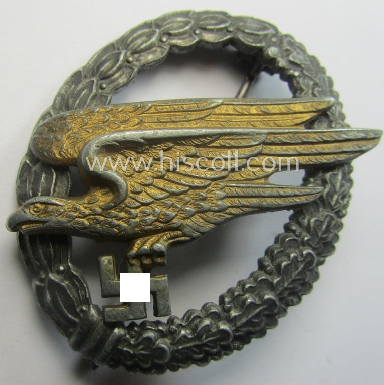 WH (Luftwaffe) 'Fallschirmschützen-Abzeichen' (or: paratroopers-jumpbadge) being a maker- (ie. 'B&N - L'-) marked- and typical zinc- (ie. 'Feinzink'-) based example by: 'Berg u. Nolte'