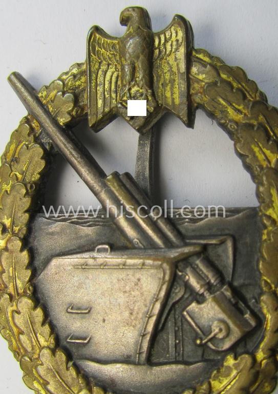 Superb - albeit moderately used but rarely seen! - WH (Kriegsmarine) 'Marine-Artillerie-Abzeichen' being a typical maker- (ie. 'Schwerin-Berlin'-) marked- and/or: 'Buntmetall'-based example as was produced by the desirable: 'Schwerin'-company