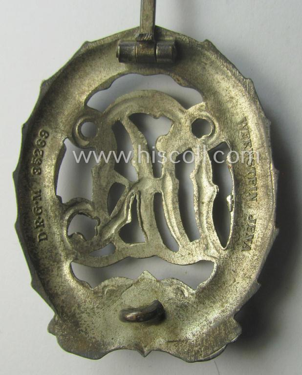 'Reichssportabzeichen DRL in Silber' (or: DRL sports'-badge in silver) being a just moderately worn- ie. used example that is nicely maker- (ie. 'Wernstein - Jena'-) marked on its back