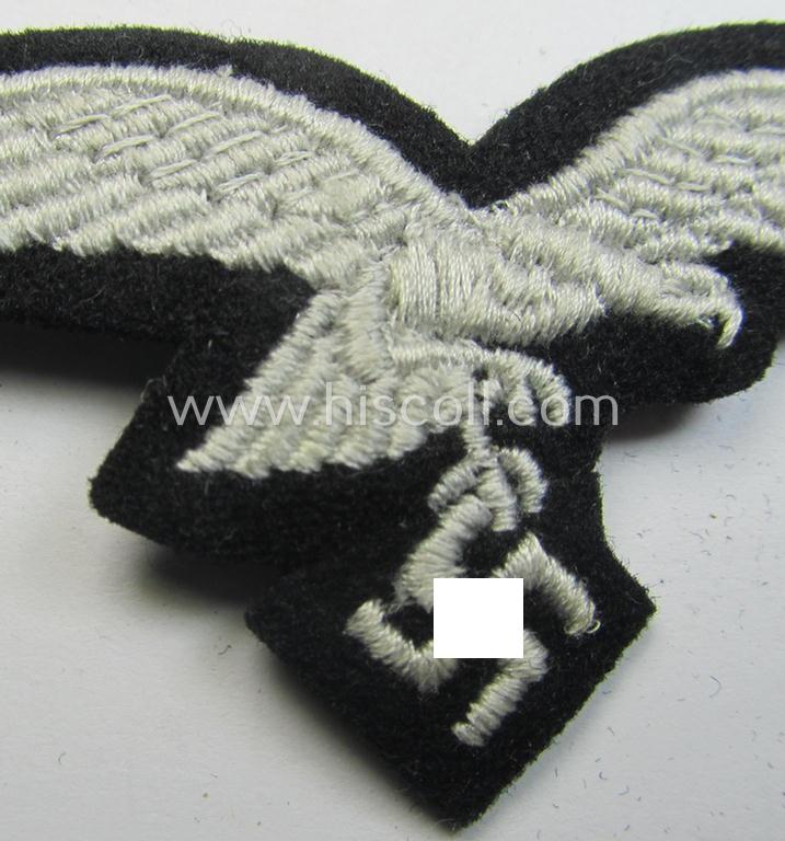 Attractive, WH (Luftwaffe) cap-eagle (being a 'standard-issue'-pattern example as executed onto a black-coloured and woolen-based  background and as such intended for usage on the black-coloured work- ie. 'HG'-related side-caps ie. 'Schiffchen'...