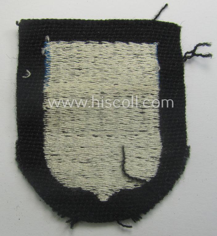 Estonian, Waffen-SS 'volunteer' arm-shield as was specifically intended for usage by soldiers of the: '20. Waffen-Grenadier-Division der SS' (ie. 'estnische Nr. 1') that comes in a 'virtually mint- ie. unissued', condition