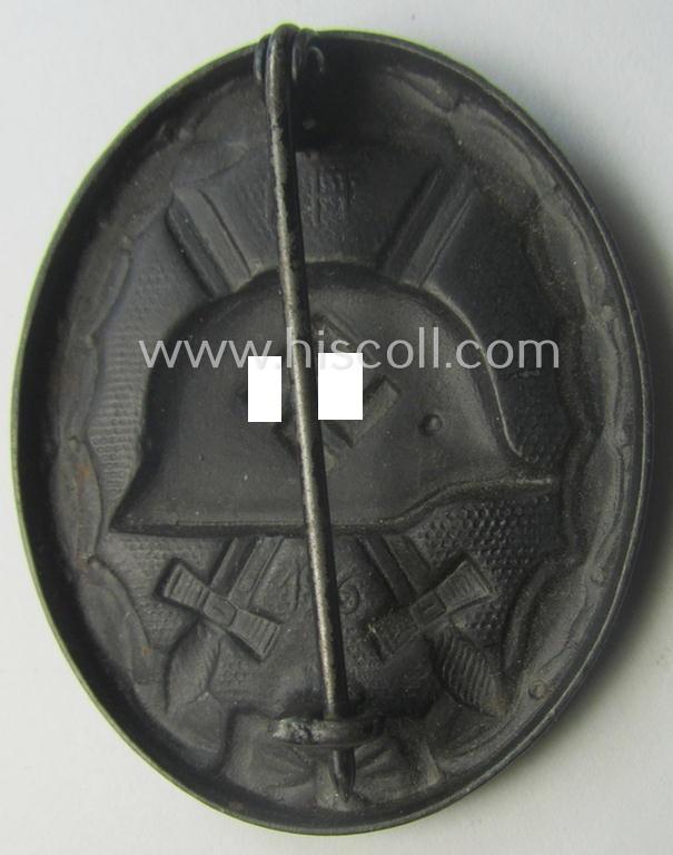 Dual-maker- (ie. 'E.H.'- and/or: '126'-) marked example of a black-class wound-badge (or: 'Verwundeten-Abzeichen in Schwarz') being an example that was produced by the maker (ie. 'Hersteller') named: 'Eduard Hahn'