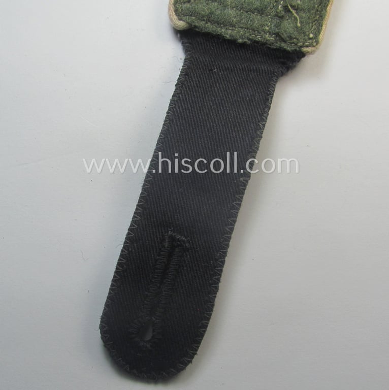 Superb, single Waffen-SS NCO-type (and neatly 'cyphered'!) shoulderstrap as piped in the white-coloured branchcolour as intended for usage by an: 'SS-Hauptscharführer' who served within the: SS-Rgt. 'Westland' ('5. SS-Pz-Gren.-Div. "Wiking")