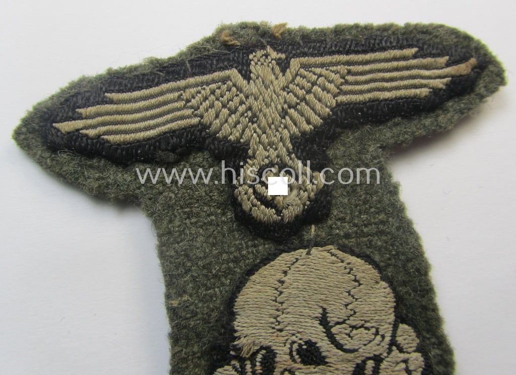 Superb - and rarely encountered! - Waffen-SS, 'BeVo'-woven-style skull- and cap-eagle-set (ie. 'Totenkopf- u. Adler-Effektensatz für Einheitsfeldmütze') that comes still mounted onto its front-piece of an 'M43'-type-cap (ie. 'Einheitsfeldmütze')