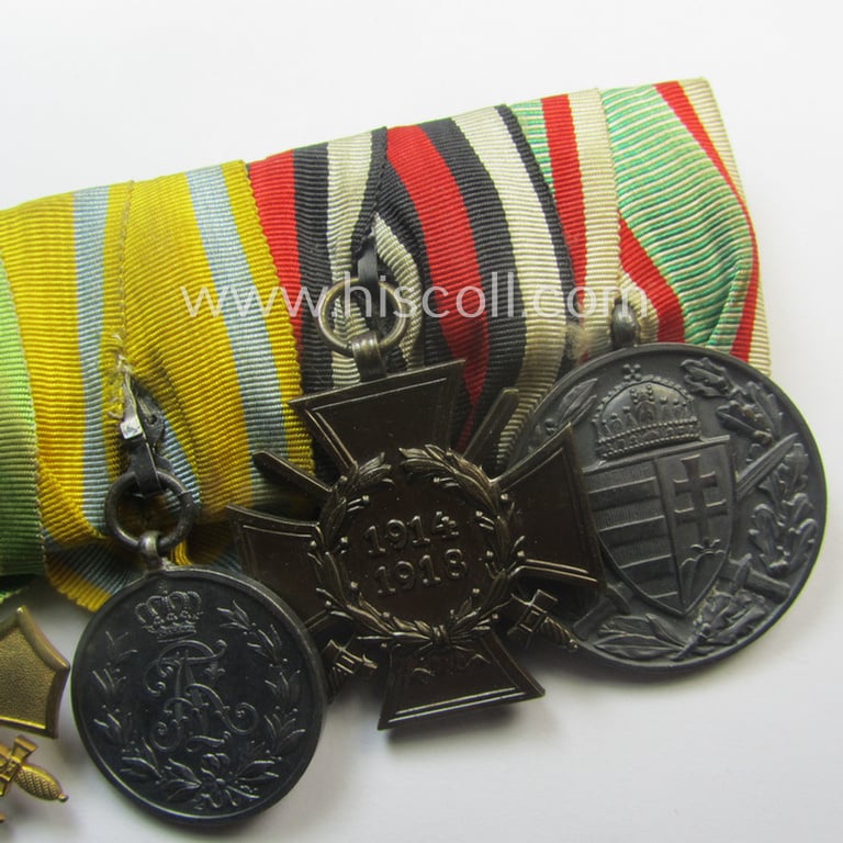 Three-pieced, (pre) 'WWI'-related medal-bar grouping (ie. 'Ordenspange-Satz') resp. depicting a WWI-period: 'EKII. Kl.', a: Sachs. 'Ehrenkreuz mit Schw.', a: 'Friedrich August Medaille in Silb.', a: 'FKK 1914-18' and an Austrian WWI-comm. medal