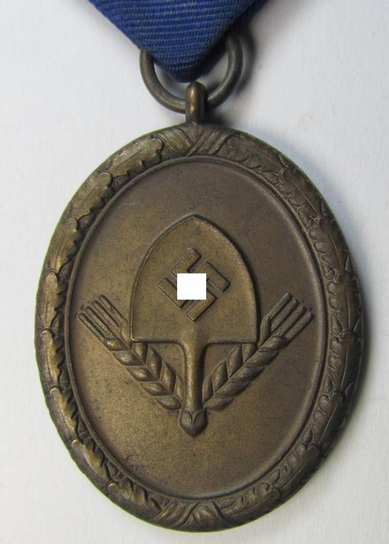 Attractive example of a: RAD (ie. 'Reichsarbeitsdienst') so-called: 'Dienstauszeichnung 4. Stufe für Männer' as was intended for 4 years loyal-service and that comes mounted onto its period piece of ribbon (ie. 'Bandabschnitt')