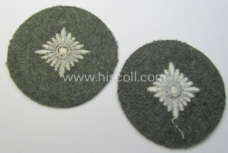 WH (Heeres) rank-insignia (ie. silver-grey-coloured and machine-embroidered 'roundel') as intended to identify a soldier with the rank of: 'Oberschütze', 'Oberjäger' etc. that comes in a 'virtually mint- ie. unissued', condition