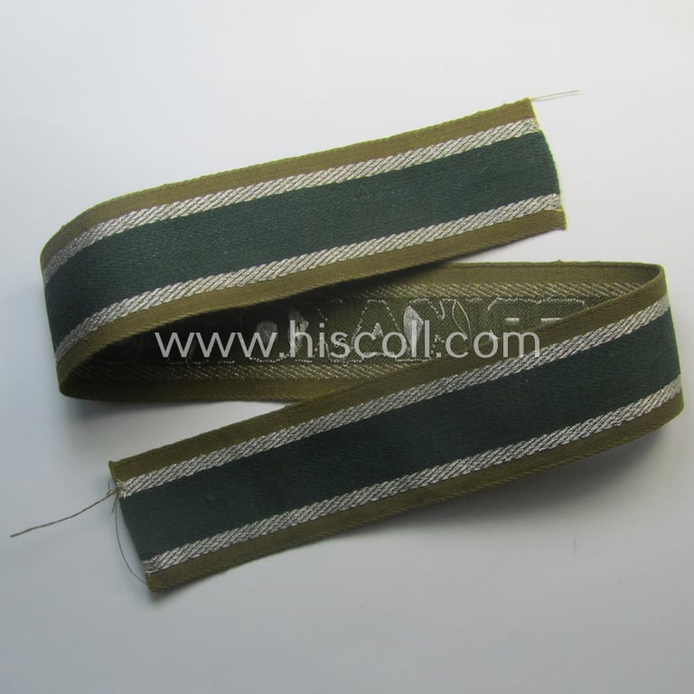 'BeVo'-like cuff-title (ie. 'Ärmelstreifen') entitled: 'Afrikakorps' being a presumably issued but simply never worn example that comes in an overall very nice- (ie. non-shortened- and never tunic-attached-), condition
