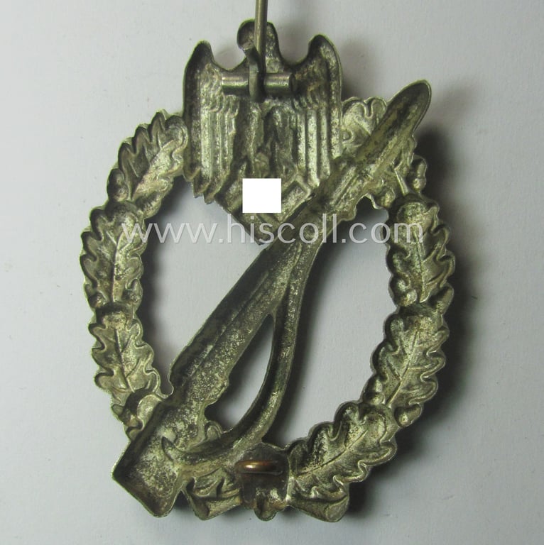 'Infanterie Sturmabzeichen in Silber' being an unmarked, 'variant'-pattern-example as executed in 'hollow-styled', silverish-toned metal (ie. 'nickle') as was produced by the: 'C.E. Juncker'-company