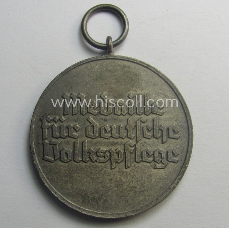 Medal-set: 'Medaille für Deutsche Volkspflege' being a non-maker-maker-marked specimen that comes still packed in its original (but damaged) pouch of issue by the 'Gebr. Godet'-company as issued and/or recently found