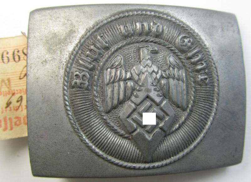 Stunning - and actually rarely encountered! - 'HJ- o. Hitlerjugend'-belt-buckle being a clearly maker- (ie. 'RzM M4/27'-) marked example (with period-attached 'RZM'-etiket!) that comes in an overall wonderful- (ie. 'virtually mint'!-), condit...