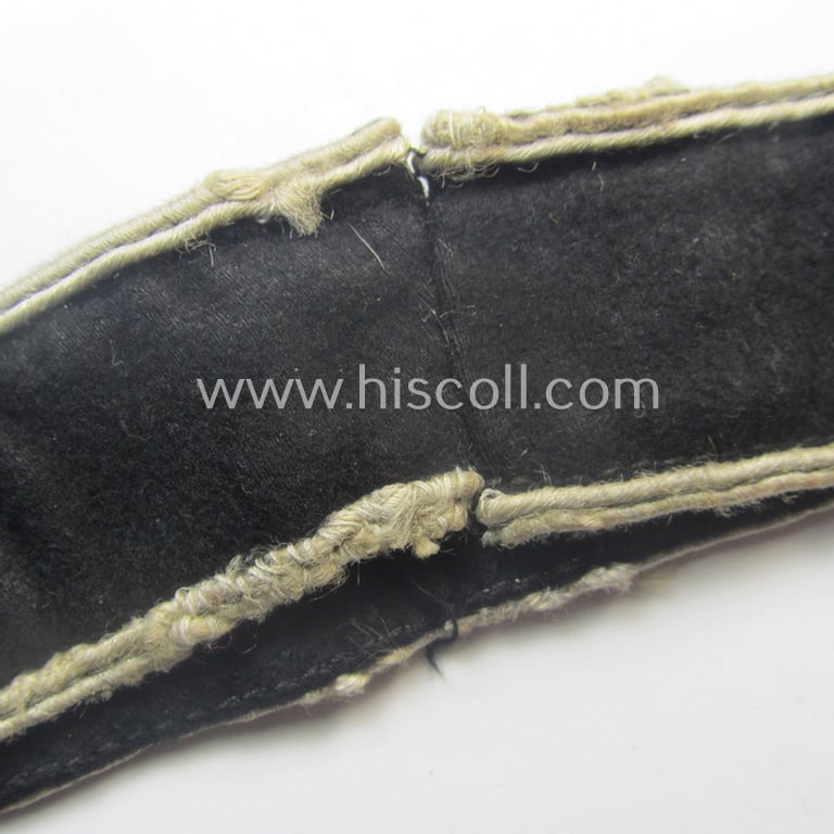 Truly used- and/or worn example of a WH (Heeres) cuff-title ie. armband (ie. 'Ärmelstreifen') entitled: 'Grossdeutschland' (being a neatly machine-embroidered example of the third pattern that was specifically intended for EM- ie. NCO-usage)