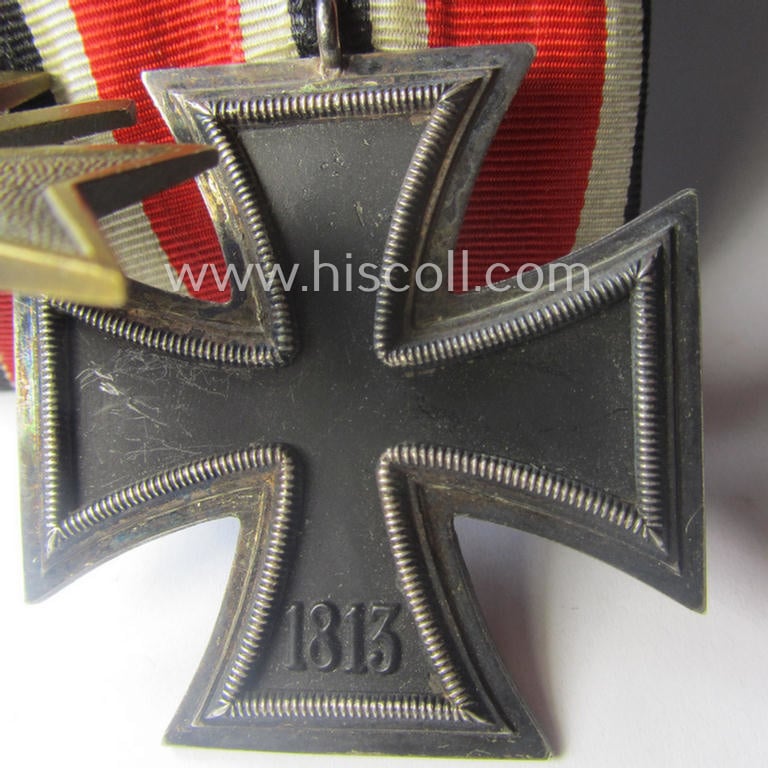 Two-pieced medal-bar (ie. 'Orden- o. Doppelspange') showing resp. an: 'Eisernes Kreuz II. Kl.' and a: 'Kriegsverdienstkreuz II. Klasse mit Schwn.' that both come period-mounted as a: 'Doppelspange'