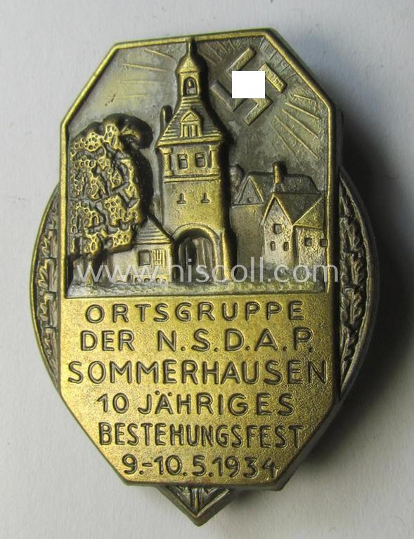 Attractive, golden-bronze-toned N.S.D.A.P.-related 'tinnie' (ie. 'Veranstaltungsabzeichen') showing an illustration of a towns'-view, sun-burst and text: 'Ortsgruppe der N.S.D.A.P. - Sommerhausen - 10 Jähriges Bestehungsfest - 9.-10.-5-1934'
