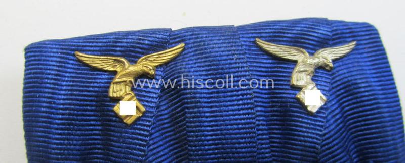 Superb, two-pieced medal-bar (ie. 'Spange') showing two: WH (Luftwaffe) so-called: 'Dienstauszeichnungen für 4 u. 12 Jahre Treue Dienste' that both come period-mounted as a so-called: 'Doppelspange'