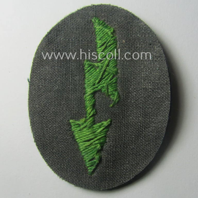 WH (Heeres) trade- and/or special-career-insignia ie. hand-embroidered 'signal-blitz' being a non-maker-marked example as executed in bright-green linnen as was specifically intended for a soldier serving within the: 'Pz.-Gren.-Trpn.'