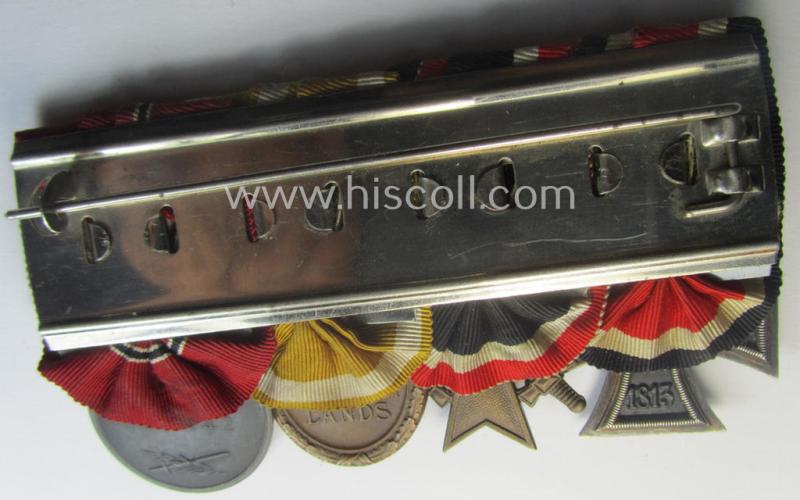 4-pieced, WWII-period medal-bar (ie. 'Ordenspange') showing resp. an: 'EKII.Kl.', a: 'KvKII.Kl. m. Schw.', a: 'Westwall'-medal and a: 'Medaille Winterschlacht im Osten 1941-42'