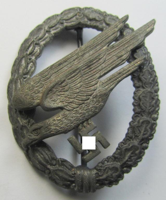 Attractive - and later-war-period! - zinc- (ie. 'Feinzink'-) based version of a WH (Luftwaffe) 'Fallschirmschützen-Abzeichen' being a clearly maker- (ie. 'A'-) marked example as was produced by the: 'Assmann'-company