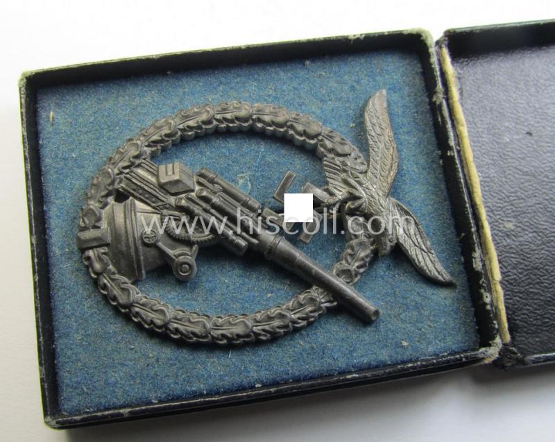 Attractive - and actually not that often seen! - later-war-period, 'Feinzink'-based example of a WH (Luftwaffe) 'Flakkampfabzeichen' (as was produced by a to date unknown maker and that comes stored in its typical etui)