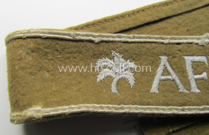 Attractive, WH (LW o. Heeres) cuff-title (ie. 'Ärmelstreifen') entitled: 'Afrika' (being a full-length example that comes in an issued-, used and/or carefully tunic-removed, condition)