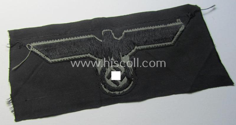 Later- (ie. mid-war-) period, WH (Heeres) 'Panzer'-type breast-eagle (ie. 'Brustadler für Panzertruppen') being a 'virtually mint- ie. unissued' example as executed in bluish-grey-coloured linnen on a black-coloured background