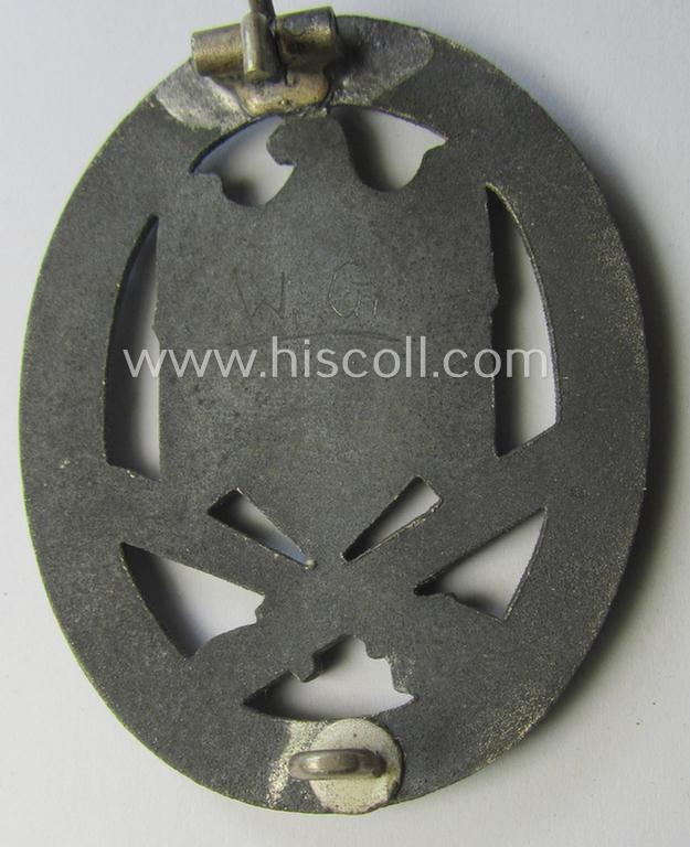 'Allgemeines Sturmabzeichen' being a non-maker-marked, zinc- (ie. 'Feinzink'-) based example by: 'C.E. Juncker'